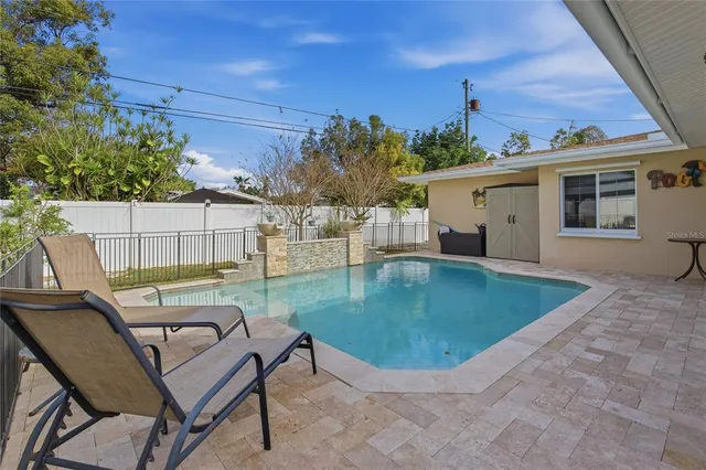 an aerial view of residential houses with city view