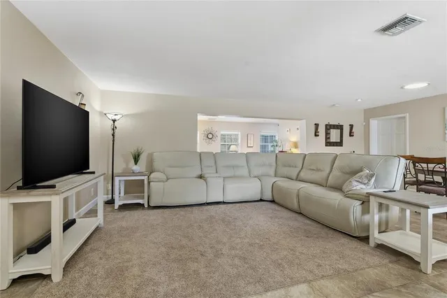 a living room with furniture and white walls
