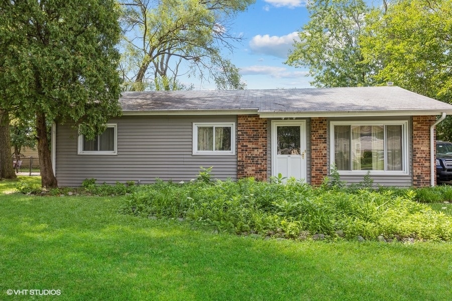 209 Bedford Road Bolingbrook, IL 60440 - Photo 1 of 11 a view of a house with a yard
