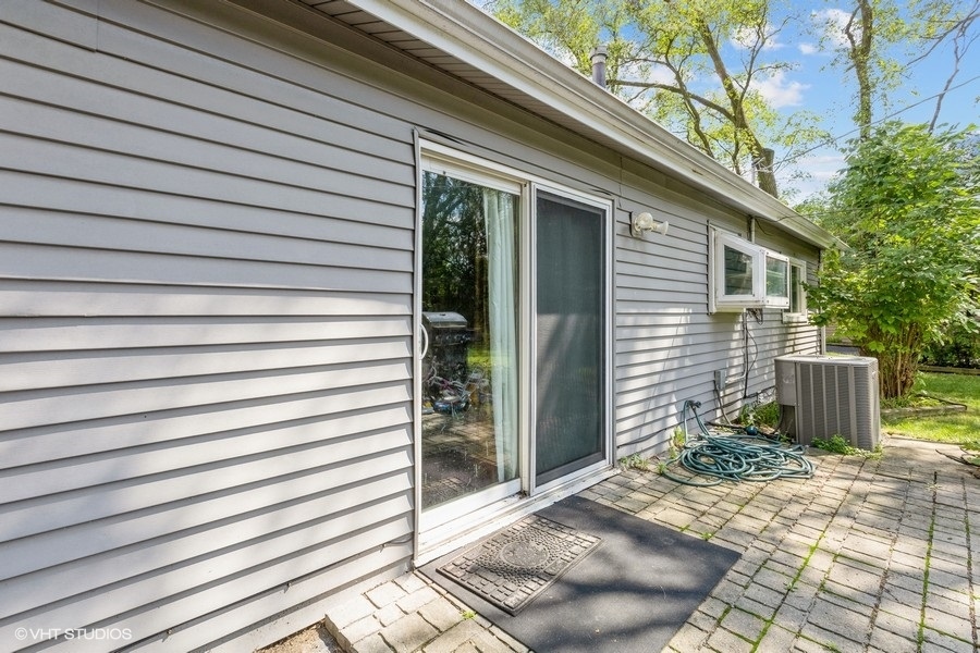 209 Bedford Road Bolingbrook, IL 60440 - Photo 2 of 11 a view of a house with a yard
