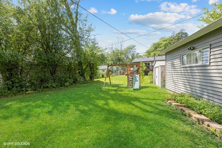 209 Bedford Road Bolingbrook, IL 60440 - Photo 3 of 11 a view of house with a backyard