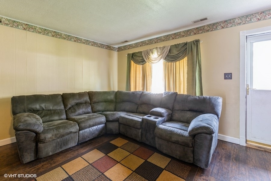 209 Bedford Road Bolingbrook, IL 60440 - Photo 4 of 11 a living room with furniture and a large window