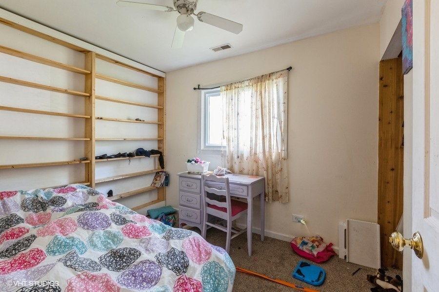 209 Bedford Road Bolingbrook, IL 60440 - Photo 8 of 11 a bedroom with a bed and a window