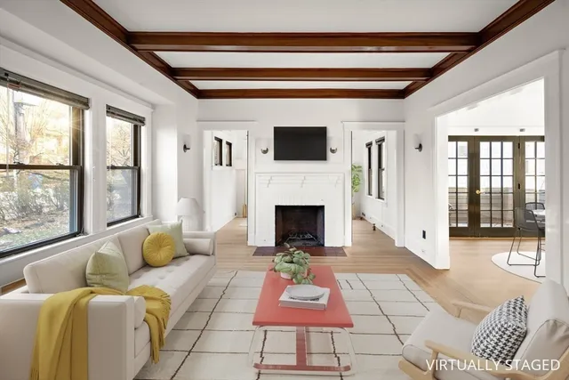 a living room with furniture and a fireplace