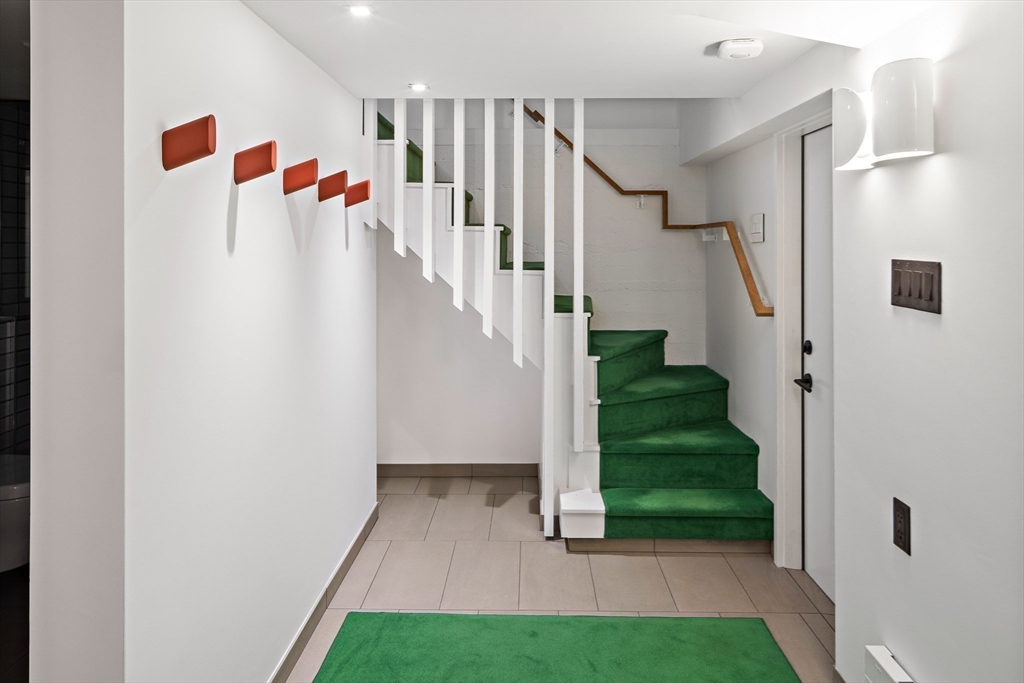 78 Gilbert Road Belmont, MA 02478 - Photo 13 of 20 a view of a hallway with a white walls