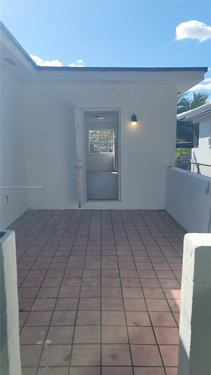 2951 Northwest 49th Street Miami, FL 33142 - Photo 17 of 19 a view of a livingroom with an empty space and a window