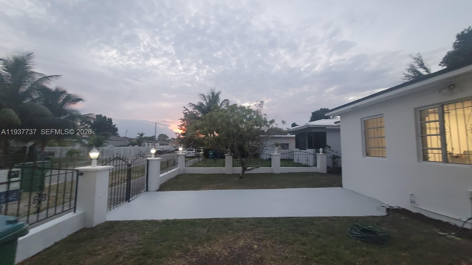 2951 Northwest 49th Street Miami, FL 33142 - Photo 2 of 19 a view of a house with a yard