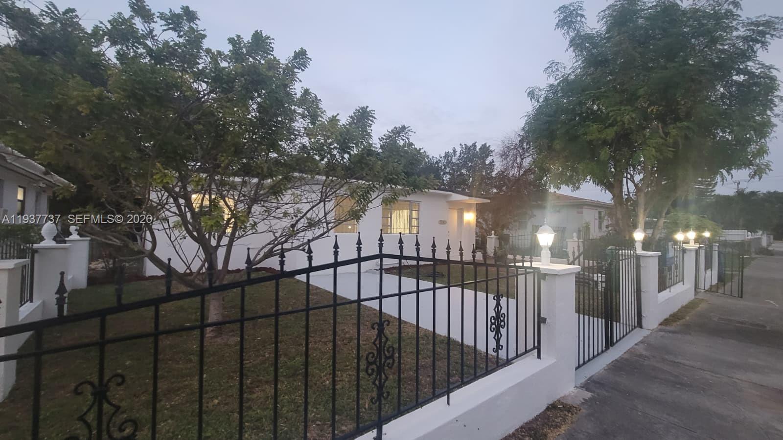 2951 Northwest 49th Street Miami, FL 33142 - Photo 3 of 19 a view of a balcony with trees