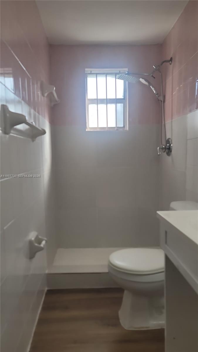 2951 Northwest 49th Street Miami, FL 33142 - Photo 7 of 19 a bathroom with a toilet and a shower