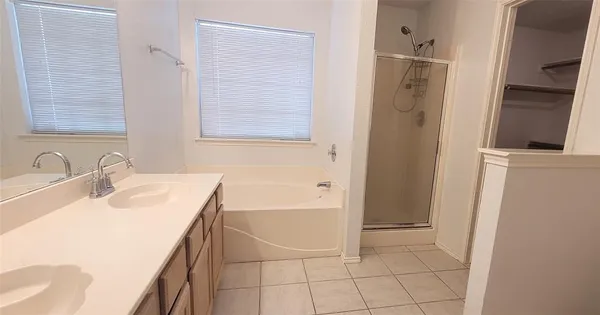 a bathroom with a sink a toilet and tub