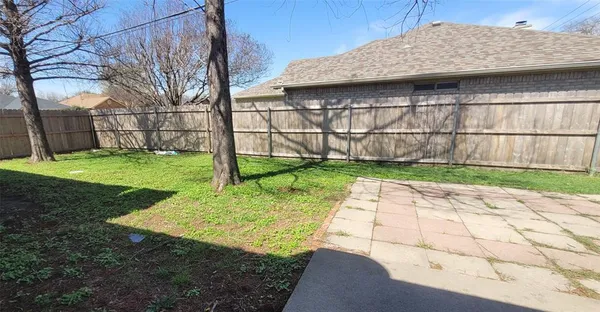 a backyard of a house with lots of green space