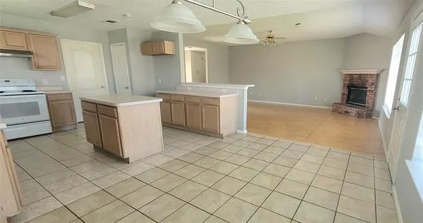 a kitchen with a sink cabinets and appliances
