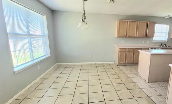 a view of a kitchen with a sink and a window