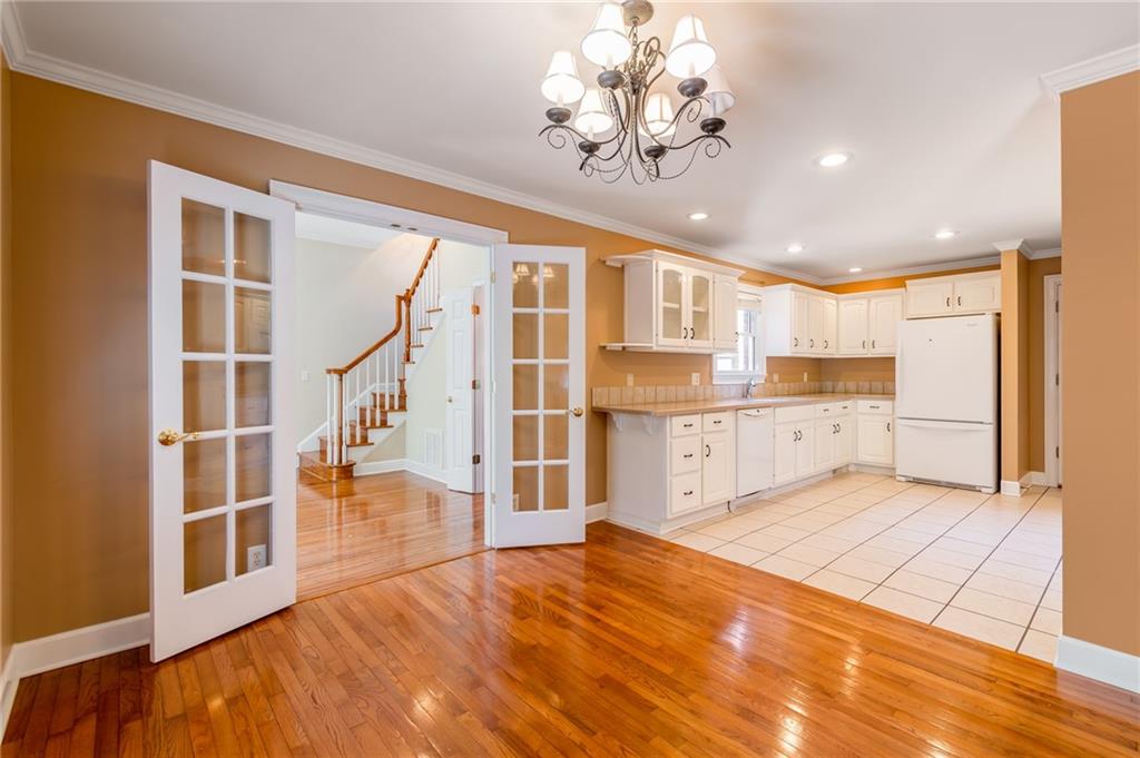 6628 Windvane Point Clermont, GA 30527 - Photo 16 of 41 a view of kitchen with furniture and wooden floor