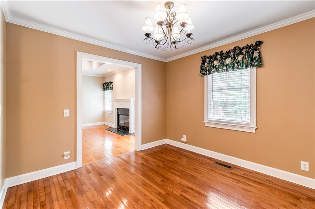 6628 Windvane Point Clermont, GA 30527 - Photo 18 of 41 wooden floor in an empty room with a window