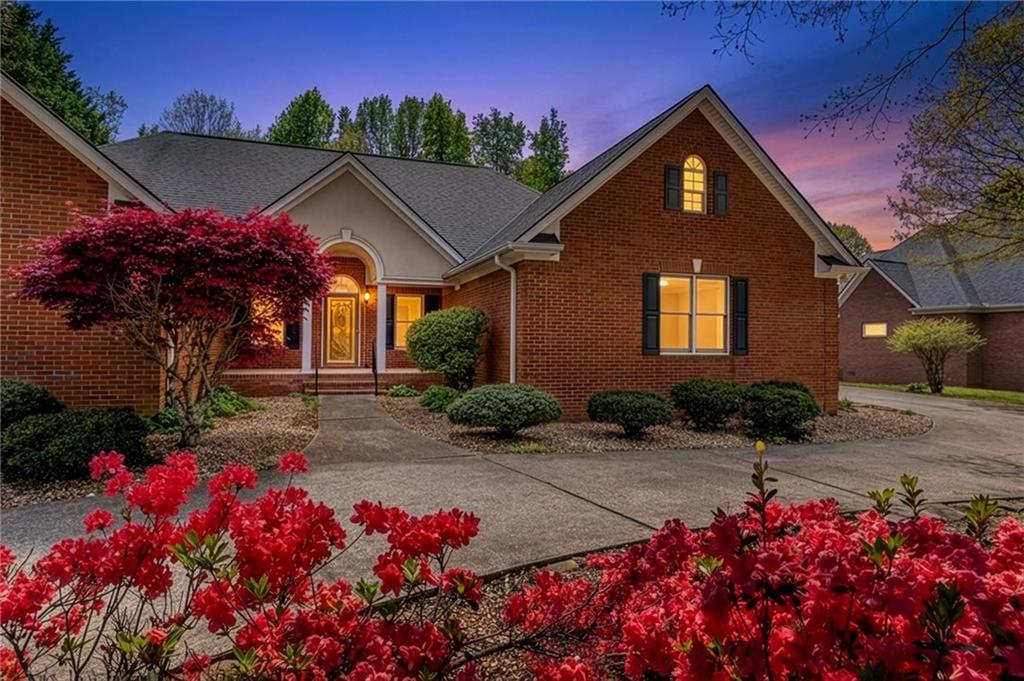 6628 Windvane Point Clermont, GA 30527 - Photo 2 of 41 a front view of a house with a yard