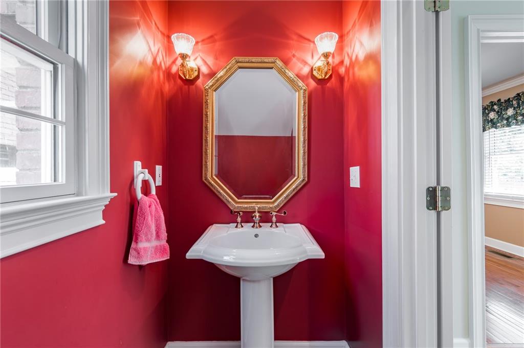 6628 Windvane Point Clermont, GA 30527 - Photo 21 of 41 a bathroom with a sink and a mirror