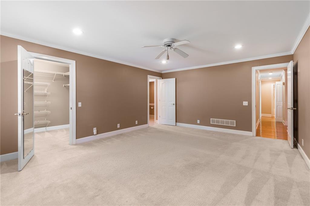 6628 Windvane Point Clermont, GA 30527 - Photo 25 of 41 a view of an empty room with a chandelier fan