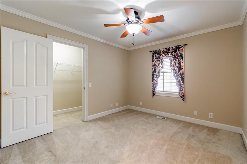 6628 Windvane Point Clermont, GA 30527 - Photo 30 of 41 wooden floor in an empty room with a window