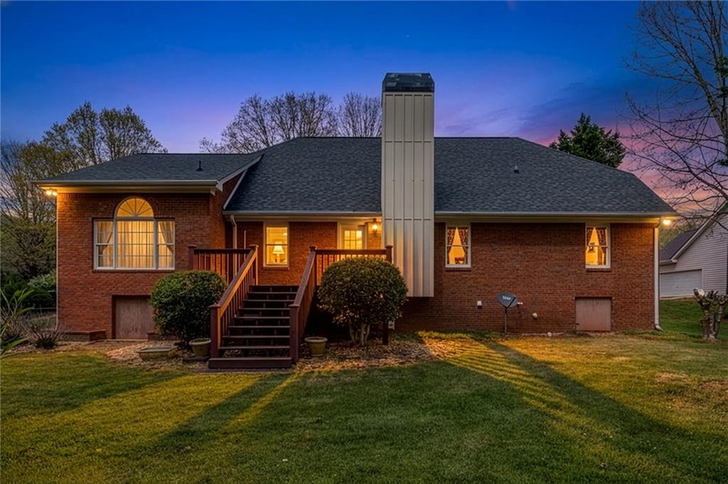 6628 Windvane Point Clermont, GA 30527 - Photo 3 of 41 a front view of a house with garden