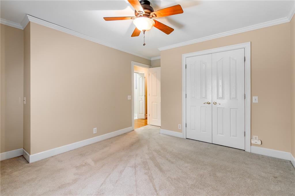 6628 Windvane Point Clermont, GA 30527 - Photo 33 of 41 an empty room with chandelier fan