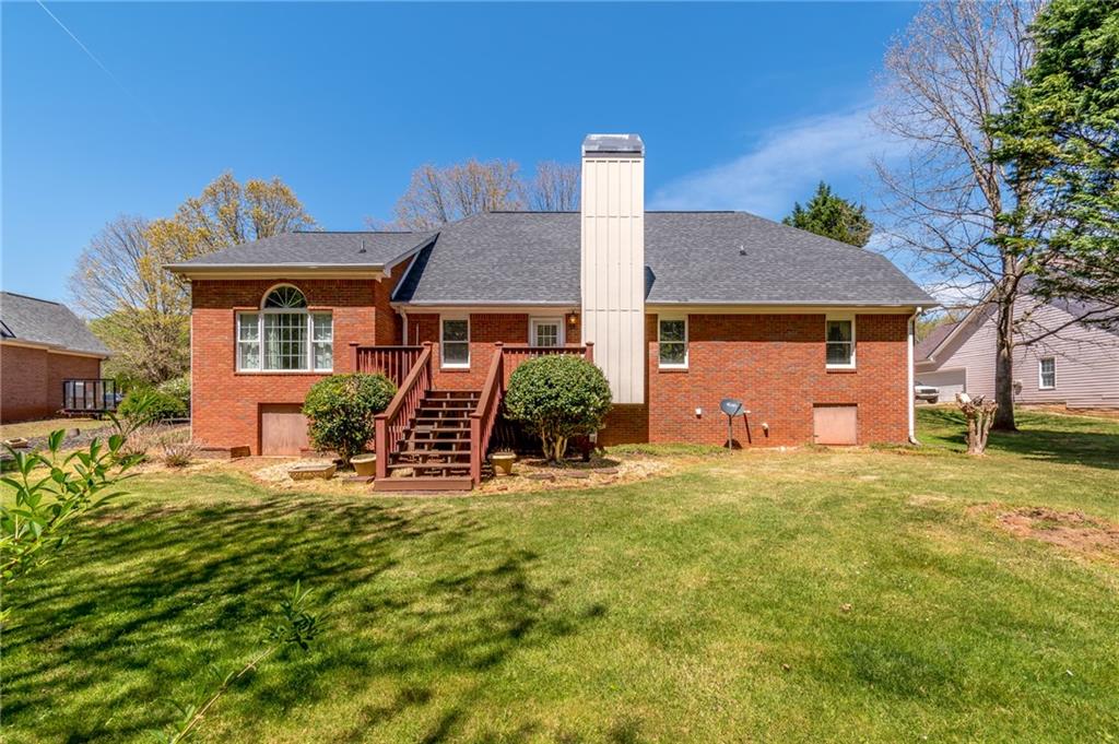 6628 Windvane Point Clermont, GA 30527 - Photo 34 of 41 a front view of a house with a yard
