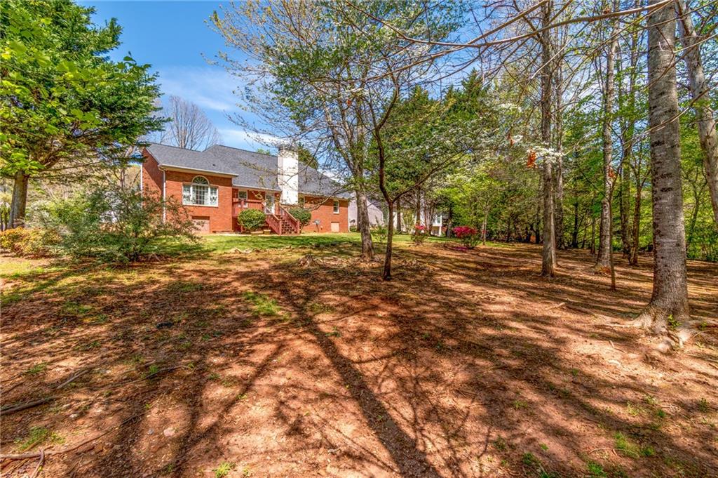 6628 Windvane Point Clermont, GA 30527 - Photo 36 of 41 a view of road with trees