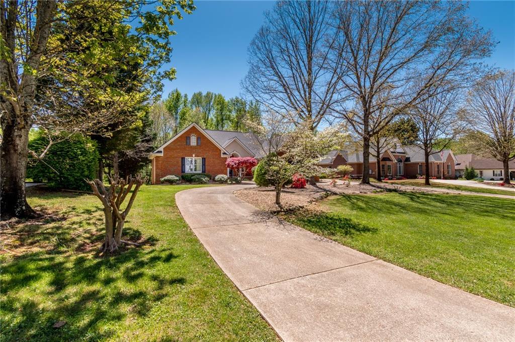 6628 Windvane Point Clermont, GA 30527 - Photo 40 of 41 a front view of house with yard and green space
