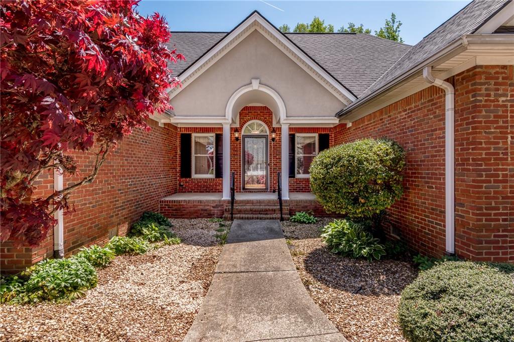 6628 Windvane Point Clermont, GA 30527 - Photo 4 of 41 a front view of a house with garden