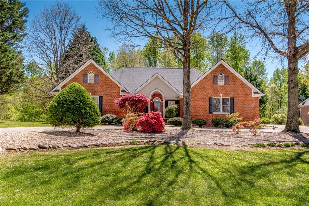 6628 Windvane Point Clermont, GA 30527 - Photo 41 of 41 a view of a house with backyard and sitting area