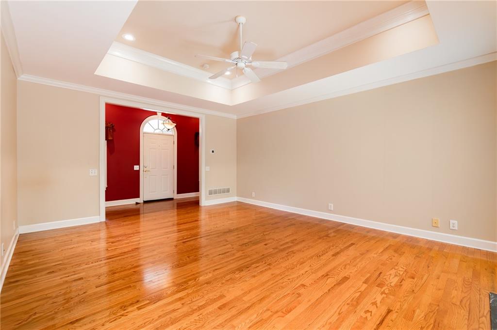 6628 Windvane Point Clermont, GA 30527 - Photo 9 of 41 a view of an empty room with wooden floor