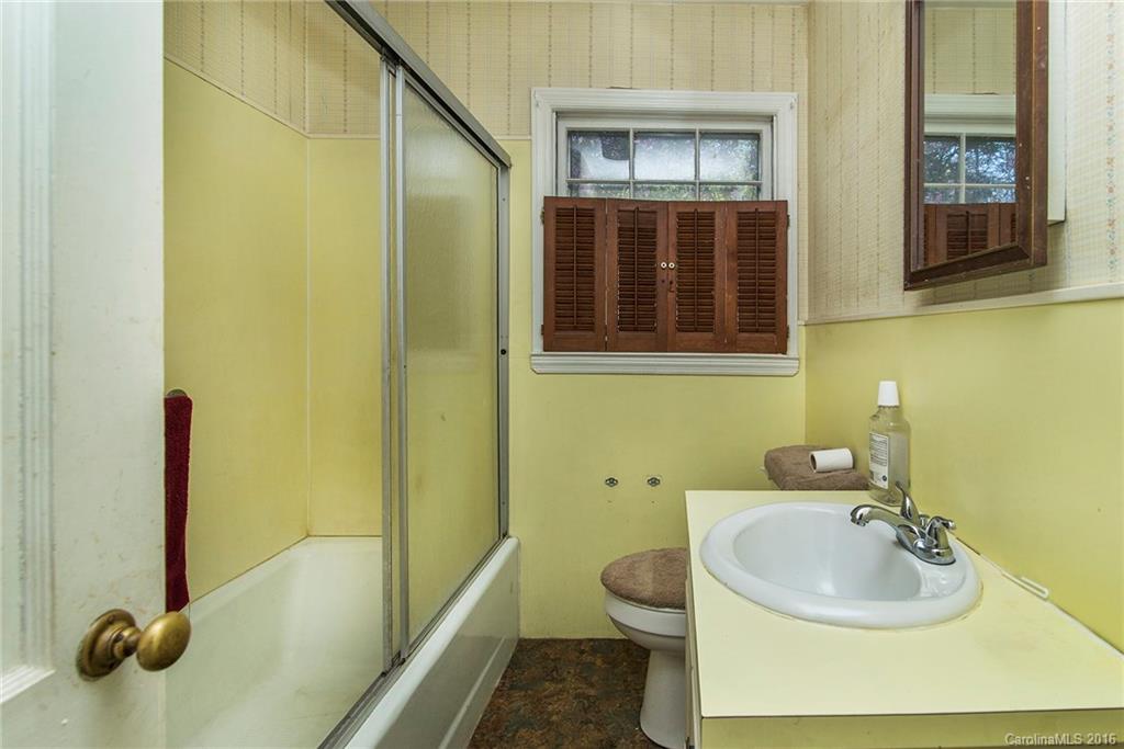 5132 Tuckaseegee Road Charlotte, NC 28208 - Photo 11 of 15 a bathroom with a sink and a mirror