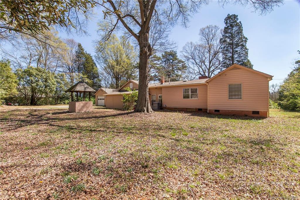 5132 Tuckaseegee Road Charlotte, NC 28208 - Photo 13 of 15 a front view of a house with a yard