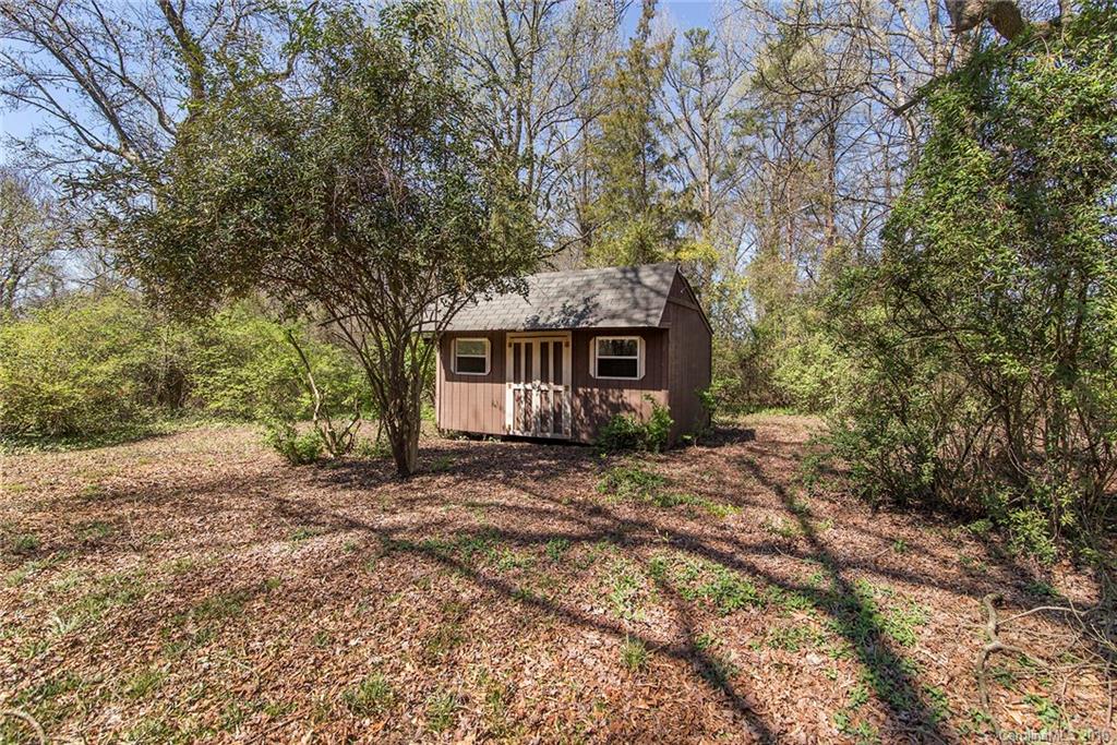 5132 Tuckaseegee Road Charlotte, NC 28208 - Photo 15 of 15 a front view of a house with a garden