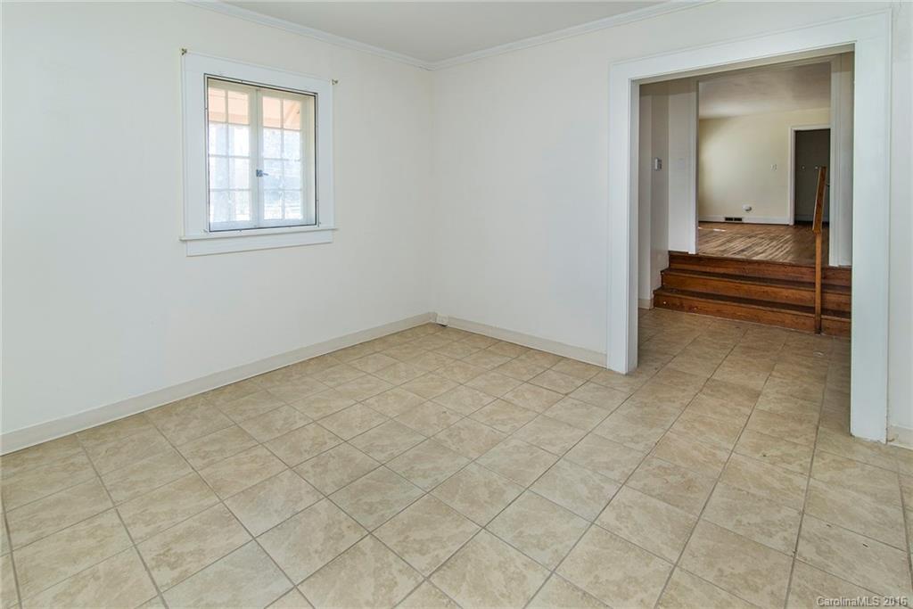 5132 Tuckaseegee Road Charlotte, NC 28208 - Photo 6 of 15 an empty room with windows