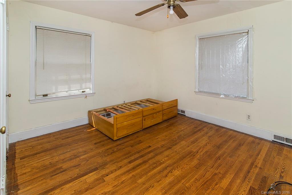 5132 Tuckaseegee Road Charlotte, NC 28208 - Photo 9 of 15 a room with a bed and window