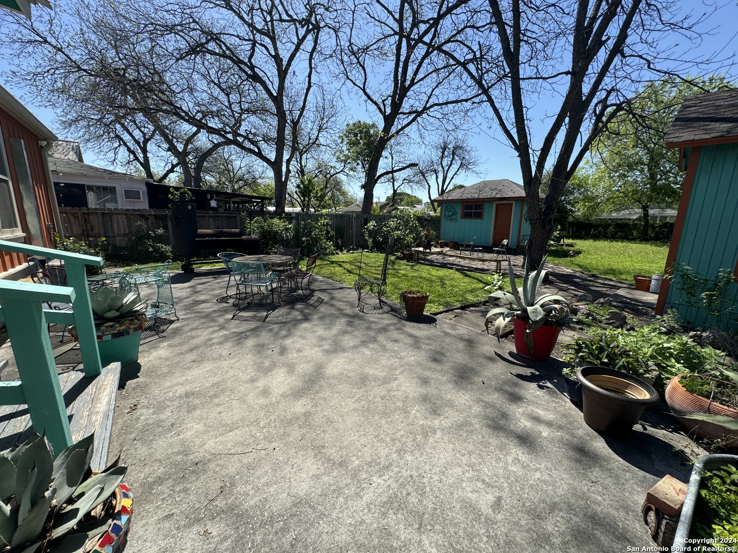 114 Helena Street, Unit 2 San Antonio, TX 78204 - Photo 14 of 14 a view of backyard with table and chairs and a large tree