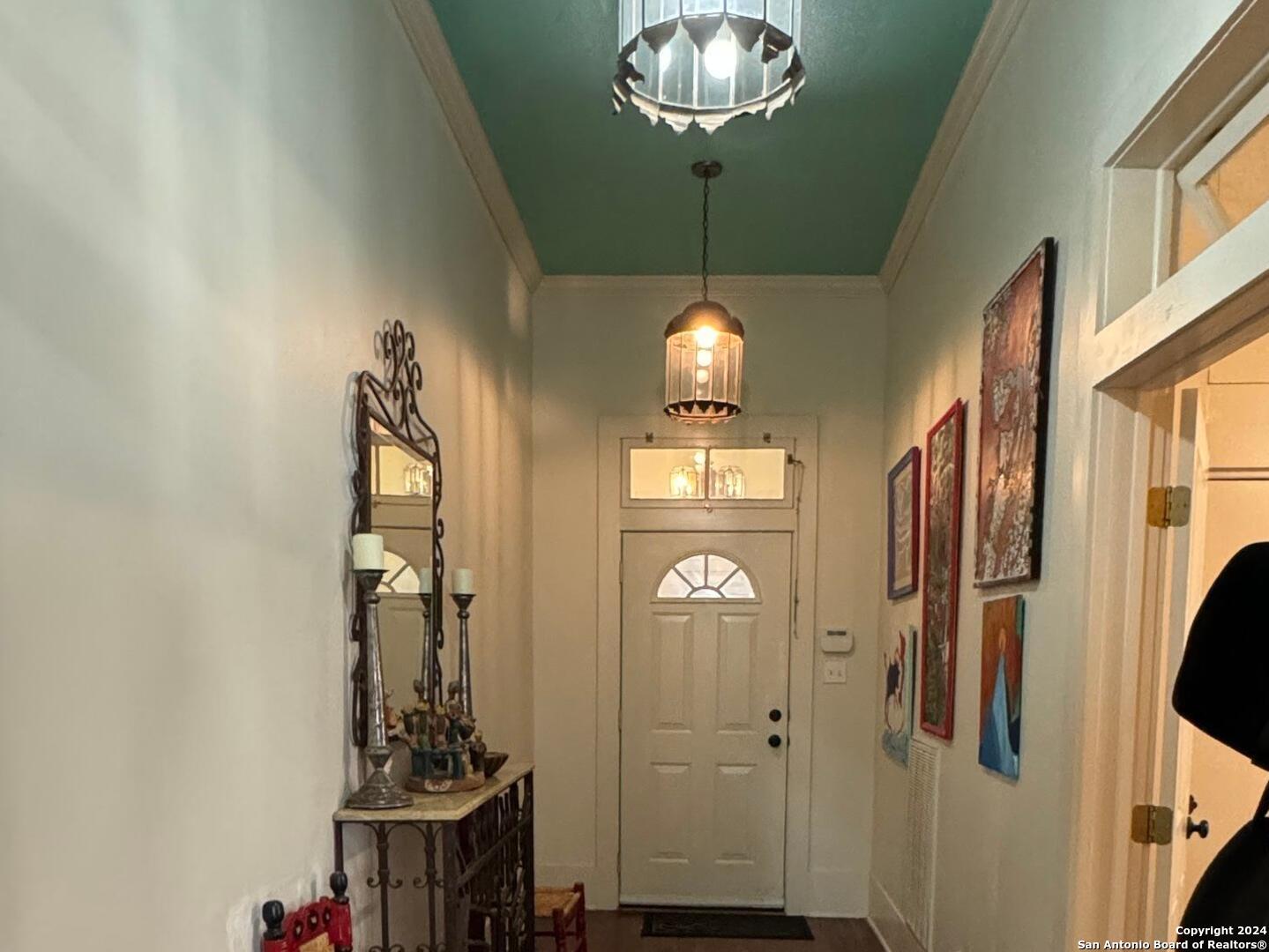 114 Helena Street, Unit 2 San Antonio, TX 78204 - Photo 4 of 14 a view of a hallway with chandelier