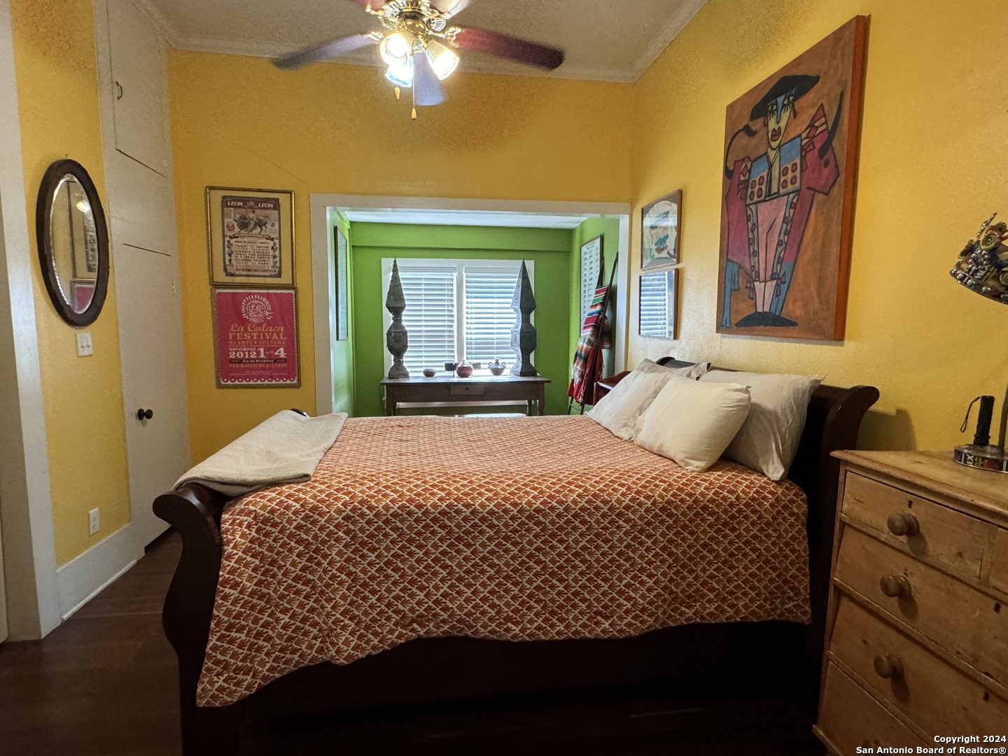 114 Helena Street, Unit 2 San Antonio, TX 78204 - Photo 6 of 14 a bedroom with a bed and painting on the wall