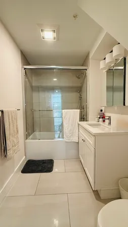 a bathroom with a bathtub sink and toilet