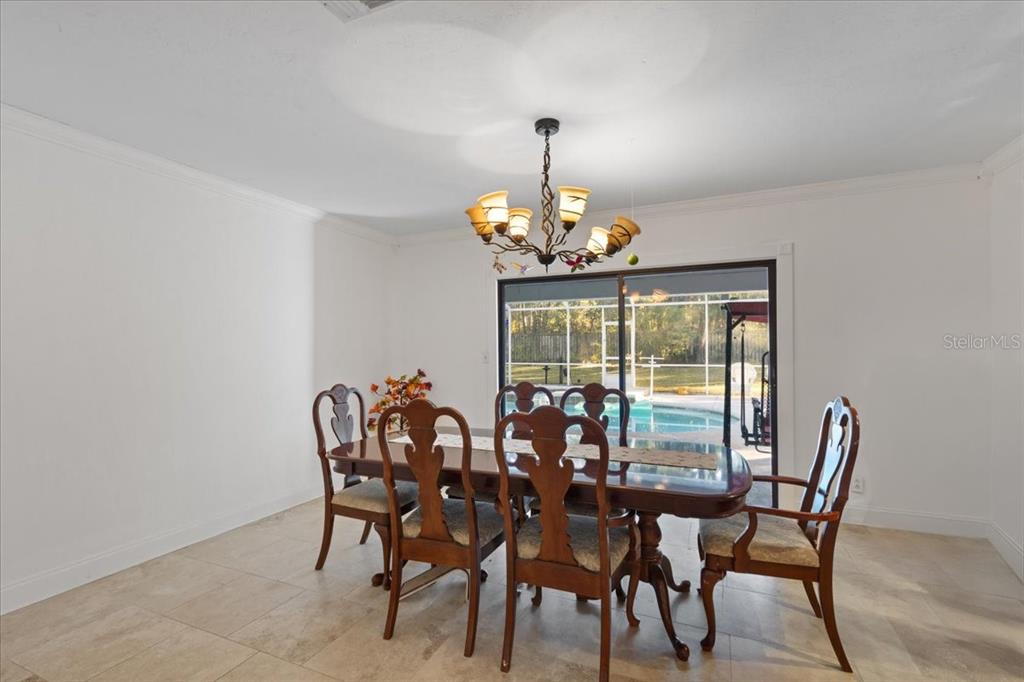 5609 Northwest 53 Court Gainesville, FL 32653 - Photo 12 of 49 a view of a dining room with furniture window and outside view