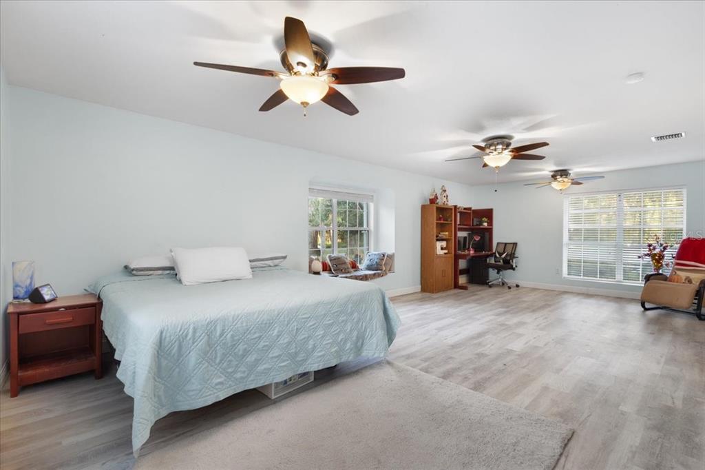 5609 Northwest 53 Court Gainesville, FL 32653 - Photo 17 of 49 a bedroom with a bed window and a couch