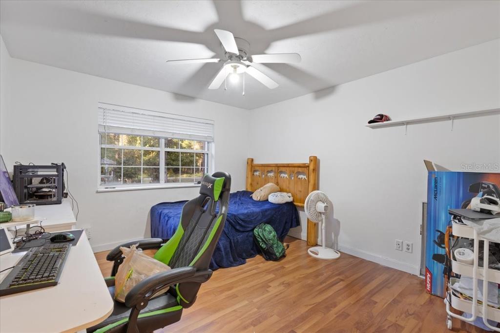 5609 Northwest 53 Court Gainesville, FL 32653 - Photo 30 of 49 a bedroom with bed and a window
