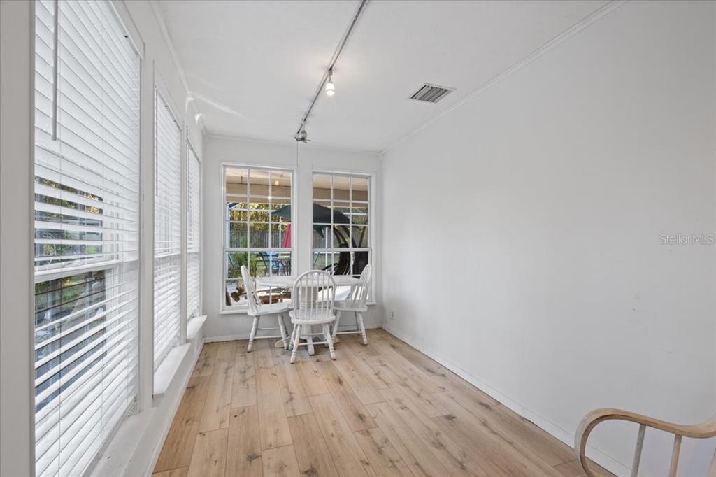 5609 Northwest 53 Court Gainesville, FL 32653 - Photo 34 of 49 a view of a room with wooden floor and furniture