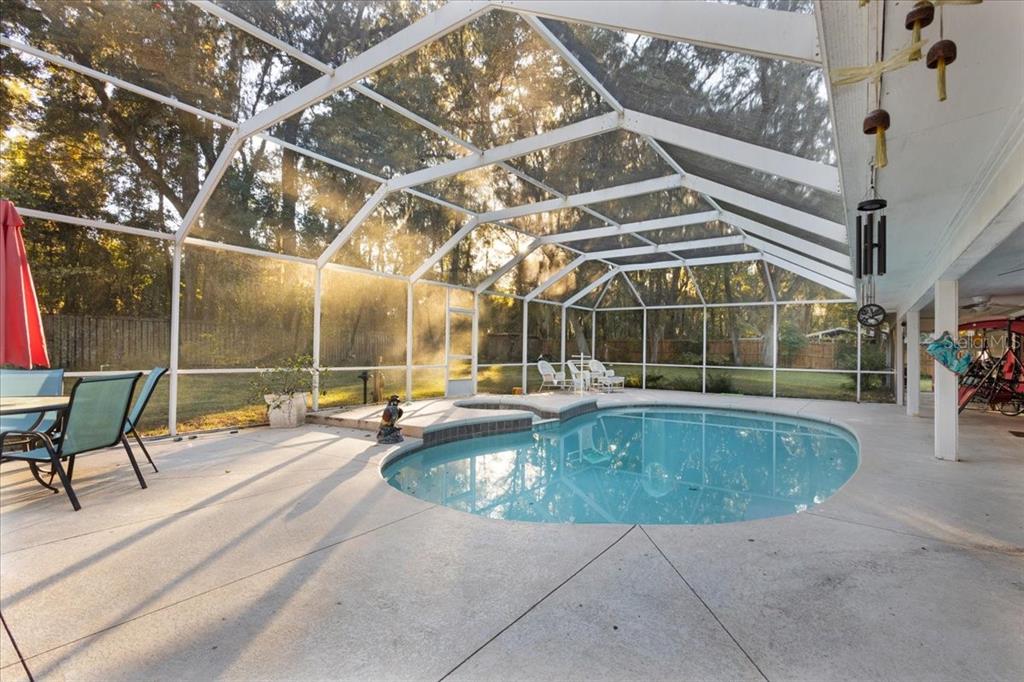5609 Northwest 53 Court Gainesville, FL 32653 - Photo 35 of 49 a view of a swimming pool with a patio