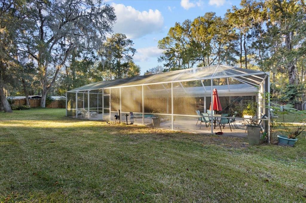 5609 Northwest 53 Court Gainesville, FL 32653 - Photo 39 of 49 a view of a house with backyard porch and sitting area