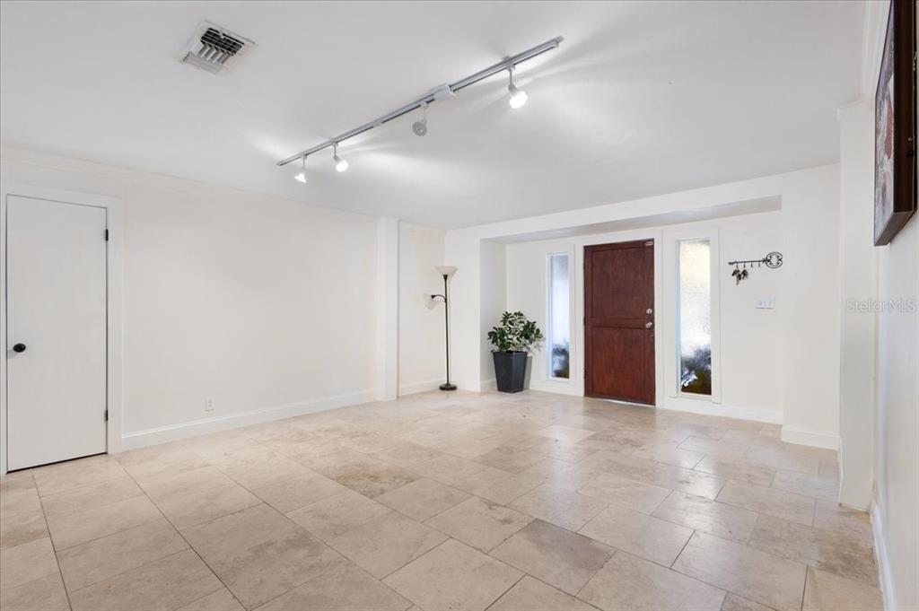 5609 Northwest 53 Court Gainesville, FL 32653 - Photo 8 of 49 a view of an empty room with potted plants