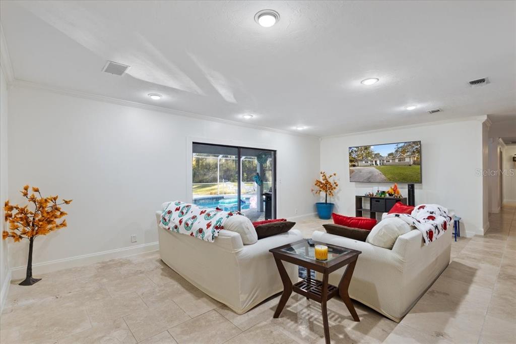 5609 Northwest 53 Court Gainesville, FL 32653 - Photo 10 of 49 a living room with furniture and flowers