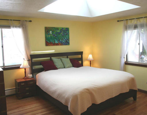 53 Upland Road West Arlington, MA 02474 - Photo 6 of 11 a bedroom with a bed and window
