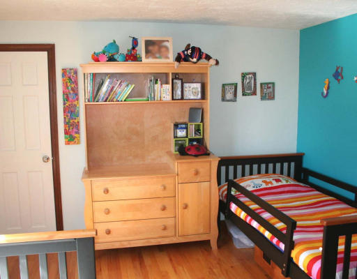 53 Upland Road West Arlington, MA 02474 - Photo 7 of 11 a bedroom with a bed and furniture
